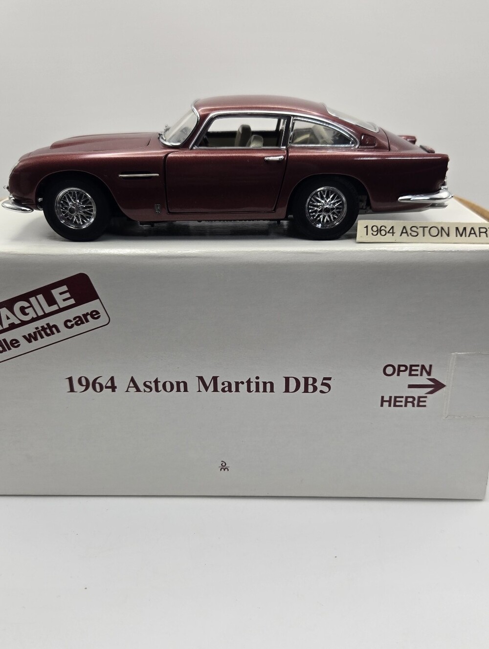 Danbury Mint 1964 Aston Martin DB5 diecast model car in Dubonnet Red